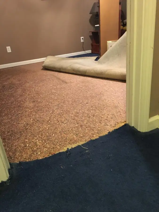 Carpet pad removal revealing water damage during Drying & Dehumidification in Chickasha